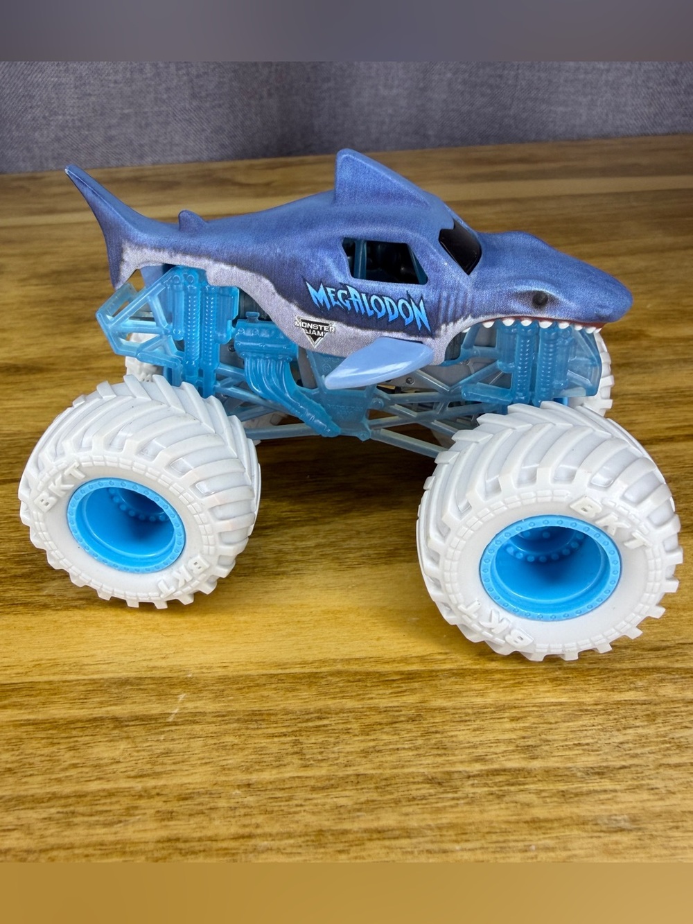 Monster Jam Megalodon Monster Truck Toy White Wheels Blue Frame